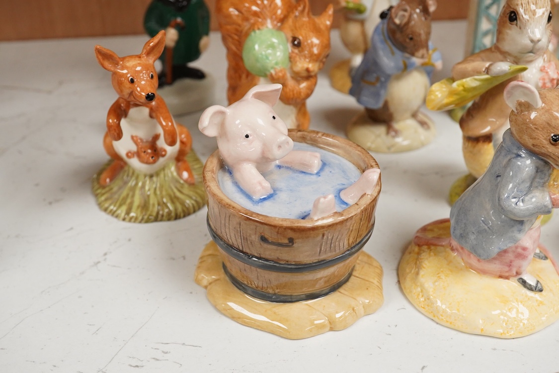 A collection of eighteen mixed Royal Doulton and Royal Albert figures of Beatrix Potter characters, largest 13cm high